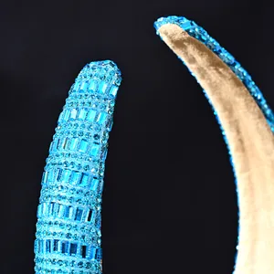 Detailed macro view of light blue crystals and golden lining on a baroque headband