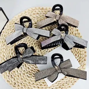 Set of five large sparkling rhinestone bow hair claws in various elegant metallic colors