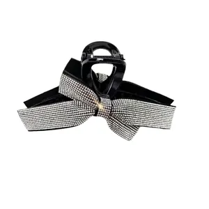 Elegant large bow hair claw clip with sparkling rhinestones in black and silver finish