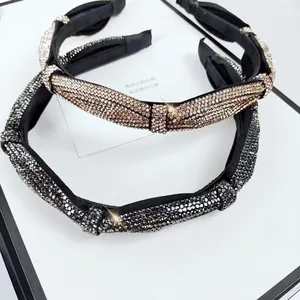 Sparkling rhinestone headband set with elegant twist knot design in gold and grey colors