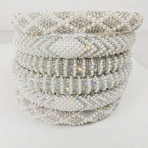 Close-up of pearl and rhinestone headbands set showing detailed jewelry craftsmanship