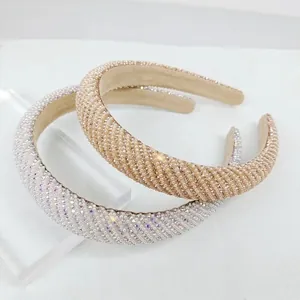 Close-up of pearl and rhinestone hairbands in silver and champagne gold finishes