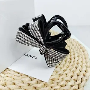 Pince à cheveux noire élégante avec nœud et strass brillants pour accessoire femme