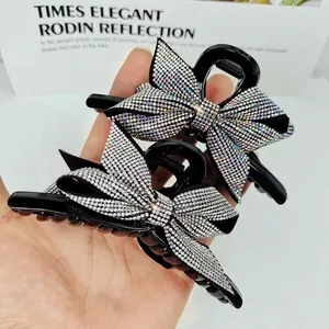 Pinza per capelli a fiocco con strass brillanti in resina nera per uno stile elegante