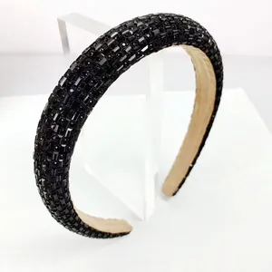 Macro detail of luxury black rhinestone headband with soft velvet inner lining