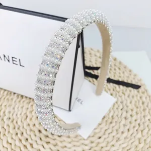 Detailed macro view of high-quality faux pearls and sparkling rhinestones on luxury headband
