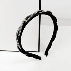Elegant black twisted headband with sparkling rhinestones for stylish hair accessories