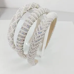 Detail of three luxury headbands with sparkling rhinestones and elegant pearls decoration