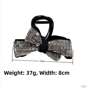 Vue détaillée de la pince à cheveux noeud de 10cm avec strass et spécifications