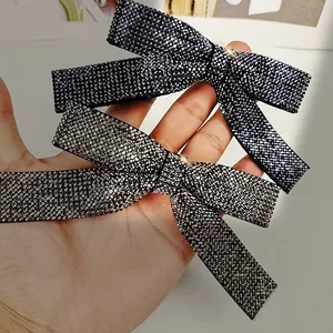 Sparkling bow hair clip with luxury rhinestones in navy blue and silver gray tones