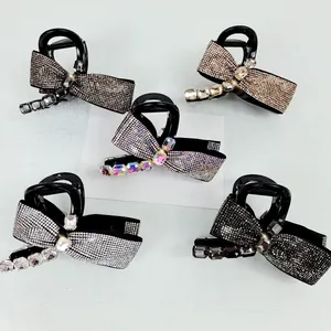 Set of 5 elegant bow-shaped hair claws with sparkling rhinestones in various colors