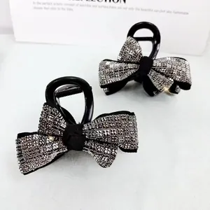 Lot de deux pinces à cheveux élégantes en forme de nœud avec strass étincelants