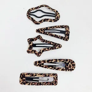 Set of 5 leopard print hair clips in various geometric shapes with black metal base