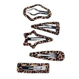 5-piece set of leopard print fabric hair clips in various shapes on white background