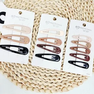 Minimalist star-shaped BB hair clips set in earthy tones for styling and fringes