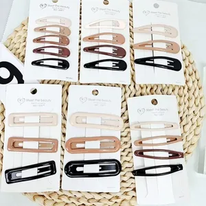 Neutral Morandi star BB hair clips set with cream and khaki snap hairpins on straw mat