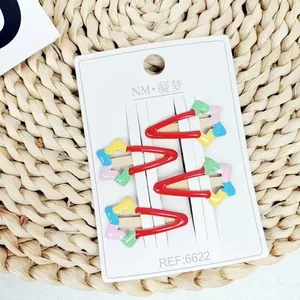 Set aus 4 süßen Kinder-Haarspangen mit Regenbogen-Stern-Design auf Display-Karte