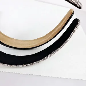 Detailed macro view of luxury full-diamond headbands with soft velvet lining in two colors