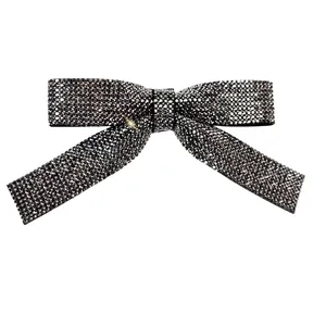 Elegant rhinestone bow hair clip with dark grey crystals in a minimalist Korean style