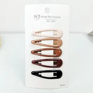Close-up of five shiny water-drop BB hair clips in gradient shades on a white card