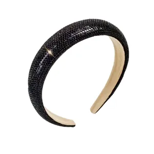 Elegant wide headband with black shimmering rhinestones in a vintage padded design