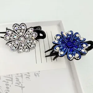 Elegant floral rhinestone hair clips set in shimmering silver and deep blue crystal
