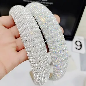 Elegant wide headband with white faux pearls and shimmering rhinestones for women