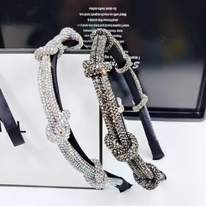 Detail of twisted knot headbands with sparkling rhinestones in AB color and grey