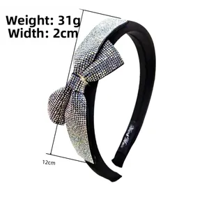 Detail view of rhinestone bow headband showing 31g weight and 2cm width measurements
