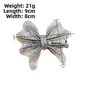 Detailed view of rhinestone butterfly hair clip with size dimensions 9cm by 8cm