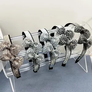 Elegant rhinestone bow headbands in five colors with sparkling crystals on black base