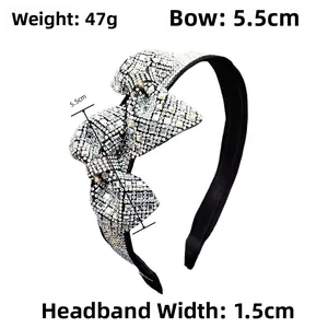 Detail showing crystal bow dimensions 5.5cm and 47g weight on black rhinestone headband