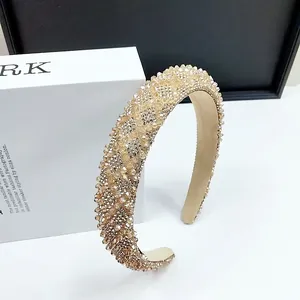 Detailed view of champagne crystal beaded headband with luxury padded sponge and shimmer finish
