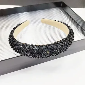 Detailed view of the sparkling black crystal headband with a luxurious padded sponge design
