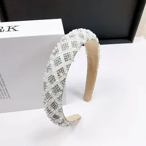 Detailed macro view of sparkling crystal headband with silver rhinestone diamond patterns