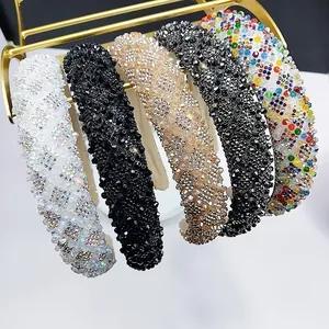 Close-up of five wide padded headbands with luxury crystal rhinestones and colorful beads