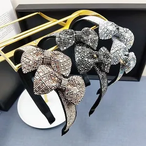 Macro detail of three luxury headbands with full crystal bow designs in various colors