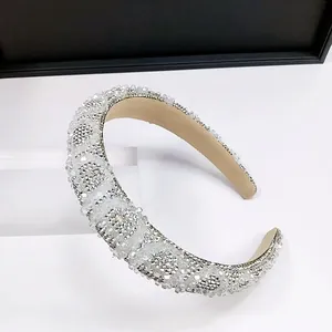 Close-up of sparkling white crystal headband with luxury rhinestone embellishments