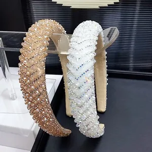 Sparkling crystal padded headband in champagne and white for a high-volume hair look