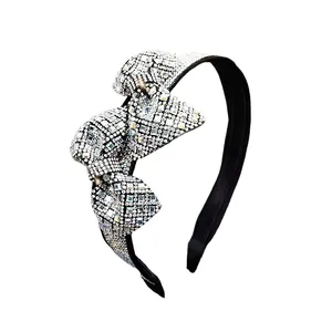 Elegant Korean style headband with luxury layered bow and sparkling crystals on black band