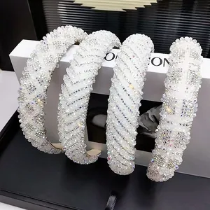 Sparkling white crystal headband with luxury rhinestones shown from a top-down view