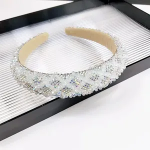 Chic padded crystal headband featuring shimmering multi-colored rhinestones and beads