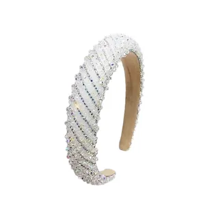 Chic white crystal headband with sparkling rhinestones on champagne velvet for parties
