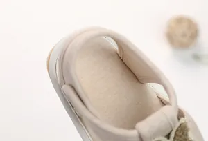 Close-up of soft cotton infant sandals showing neat stitching and breathable fabric lining