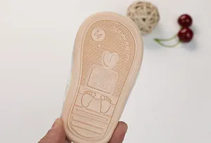 Close-up of flexible soft rubber sole for toddler shoes with non-slip snail pattern