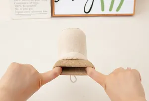 Detail view of cotton-linen scrub mitt with elastic cuff and white hanging loop
