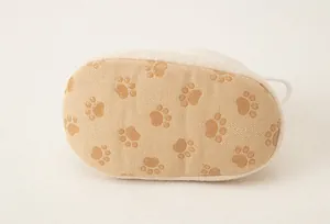 Detail of baby walking shoes featuring canvas sole with brown anti-slip cat paw prints
