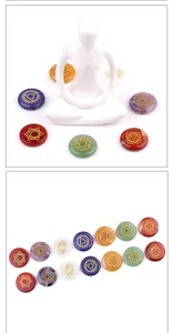 Detailed view of seven chakra energy stones with golden symbols and meditation decor