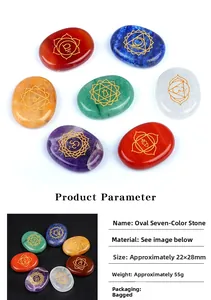 Detail of seven oval chakra energy stones featuring golden engraved healing symbols