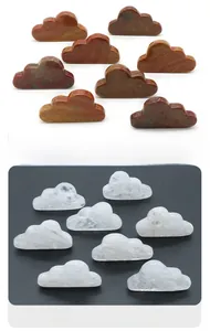 Detailed comparison of cloud-shaped marine agate and clear quartz gemstone carvings